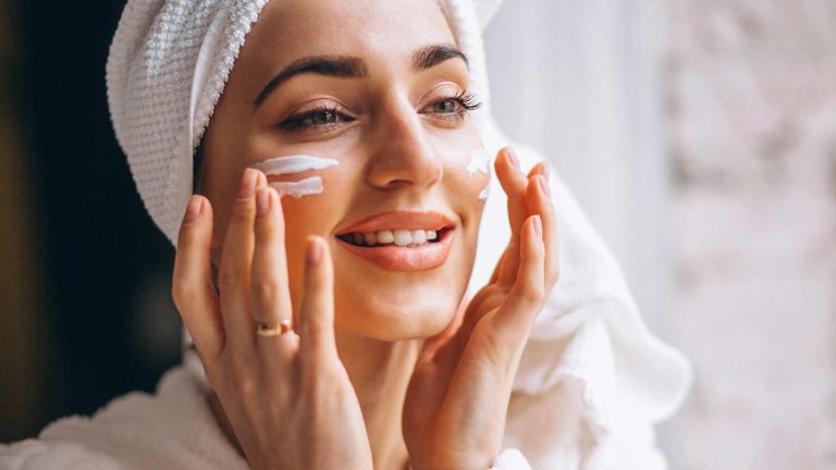 woman-applying-face-cream