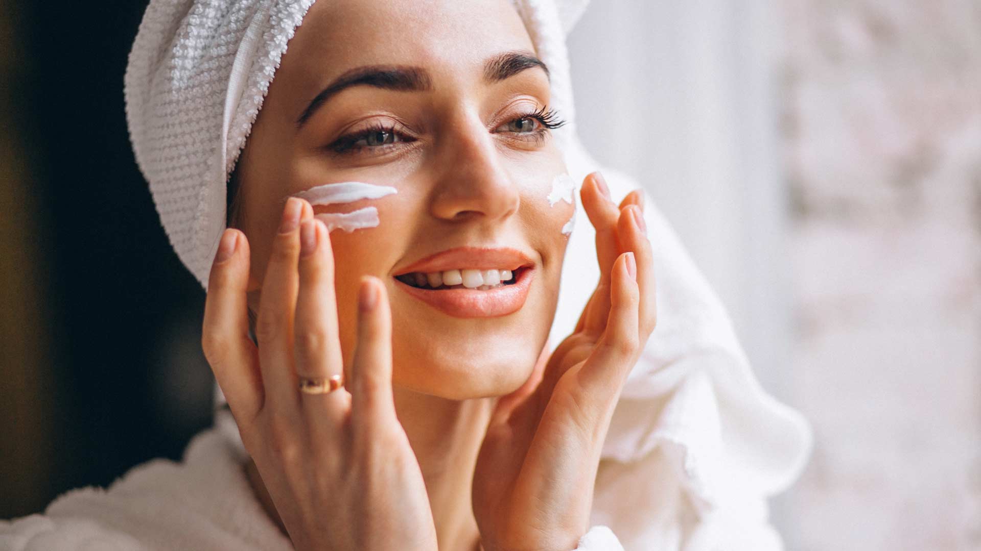 woman-applying-face-cream